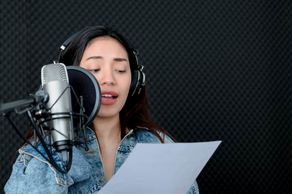 Asian Women Recording in vocal booth